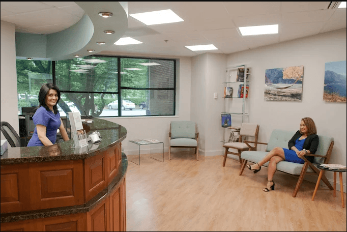 Fairfax Advanced Dentistry reception area with front desk and waiting room
